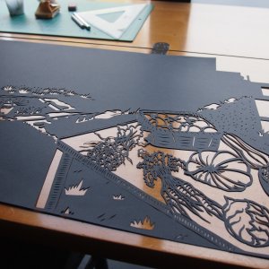 I hand cut my works from black paper with an Xacto knife and patience. This is a scene from a music video 