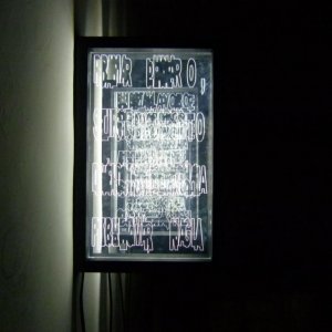 Kronos, 2018, dalla serie Tavolette di Armonia. Plexiglass inciso e illuminato a led, legno. Ognuno 38x24 cm. 